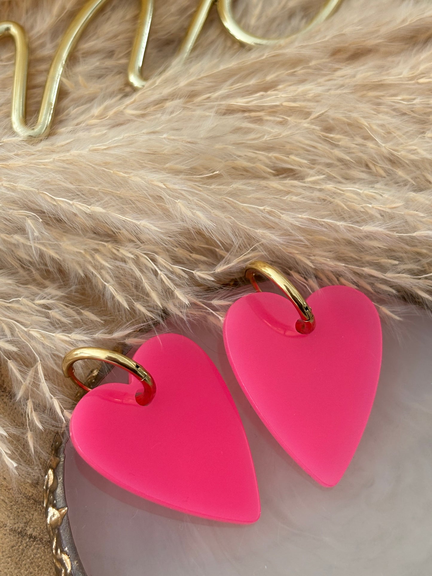 Boucles d’oreilles rose fluo